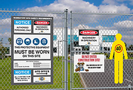 Outdoor fence with safety hazard warning signs